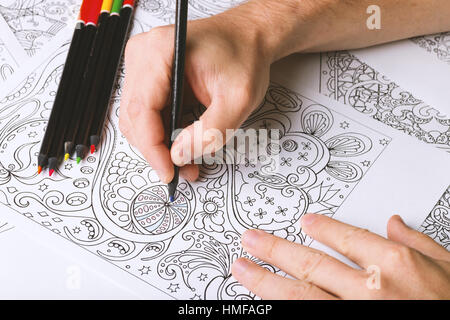 Coloring pages for adults is zen and antistress tool. Hobby that help you relax. Stock Photo