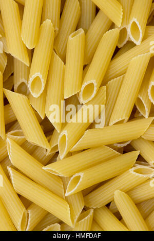 Penne pasta background close up Stock Photo