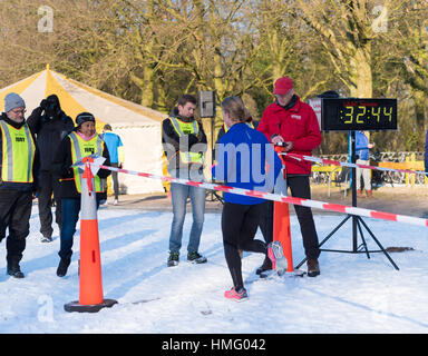 OLDENZAAL, NETHERLANDS - JANUARY 22, 2017: unknown people at the finishing line during a running race in the snow Stock Photo