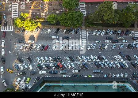 Car parking lot viewed from above in the evening Stock Photo