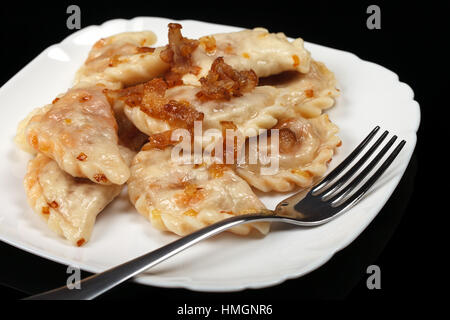 Traditional Ukrainian dumplings with bacon Stock Photo