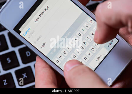 macro of typing hello message in smartphone Stock Photo