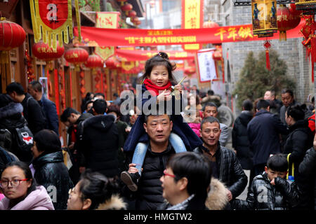 Jincheng City, China. 3rd Feb, 2017. Tourists cram to an ancient street during the Spring Festival holiday in Jincheng City, north China's Shanxi Province, Feb. 1, 2017. China's tourism industry raked in 423.3 billion yuan (61.7 billion U.S. dollars) in revenue during the Lunar New Year holiday. Credit: Xinhua/Alamy Live News Stock Photo