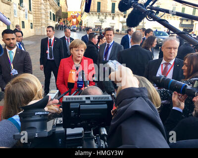 Valletta, Malta. 3rd Feb, 2017. German Chancellor Angela Merkel, in red, speaks to journalists as she arrives for an informal summit of EU, migration is main topic on agenda, in Valletta, Malta, on Friday, February 3, 2017. Credit: Jakub Dospiva/CTK Photo/Alamy Live News Stock Photo