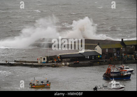 Lyme Regis, Dorset, UK.  3rd February 2017.  UK Weather.  Stormy waves whipped up by gales smash into The Cobb harbour wall at Lyme Regis in Dorset on a morning or strong winds and rain.  Photo by Graham Hunt/Alamy Live News Stock Photo