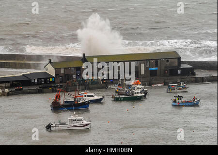 Lyme Regis, Dorset, UK.  3rd February 2017.  UK Weather.  Stormy waves whipped up by gales smash into The Cobb harbour wall at Lyme Regis in Dorset on a morning or strong winds and rain.  Photo by Graham Hunt/Alamy Live News Stock Photo