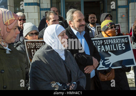 Bloomfield Hills, USA. 3rd February, 2017. Interfaith religious leaders rally during Friday prayers at the Muslim Unity Center in solidarity with the Muslim community and against the Trump administration's immigration/refugee ban. Syrian refugees (center), whose family was separated by the ban, attended the event. Credit: Jim West/Alamy Live News Stock Photo