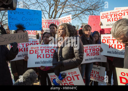 Detroit, USA. 3rd February, 2017. Students from Osborn High School protest against the planned closing of their school, one of 24 the state of Michigan wants to shut in Detroit because of poor academic performance. Detroit teachers have long complained about large class sizes, outdated textbooks, and lack of resources. Ivy Bailey, interim president of the Detroit Federation of Teachers, speaks at the rally. Credit: Jim West/Alamy Live News Stock Photo