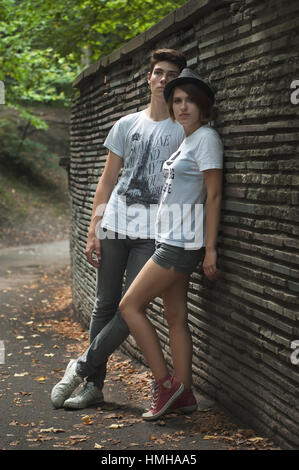 Young amazing students couple in the park. Love Care Fashion concept Stock Photo