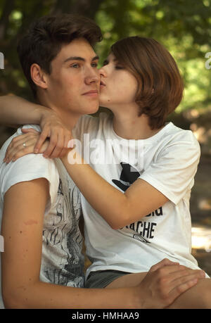 Young amazing students couple in the park. Love Care Fashion concept Stock Photo