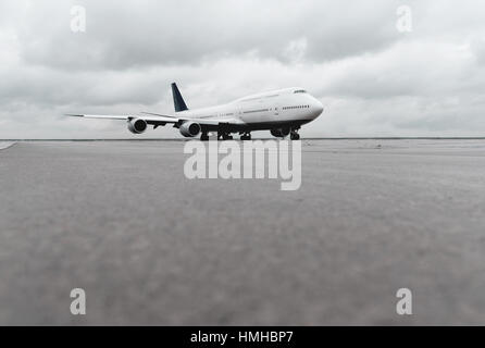 low angle view of big airliner passenger jet plane on taxiway or runway