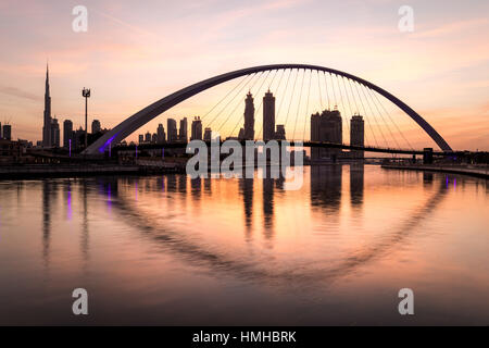 Dubai, UAE - Jan 27, 2017: Colorful sunrise over Dubai Downtown as viewed from the Dubai water canal. Stock Photo