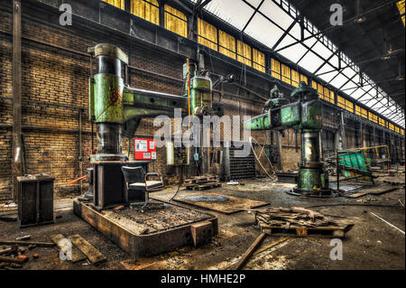 Huge radial drills in an abandoned factory Stock Photo