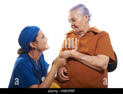 nurse help old woman isolated on white Stock Photo