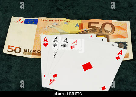 On banknotes card is a combination of four aces Stock Photo