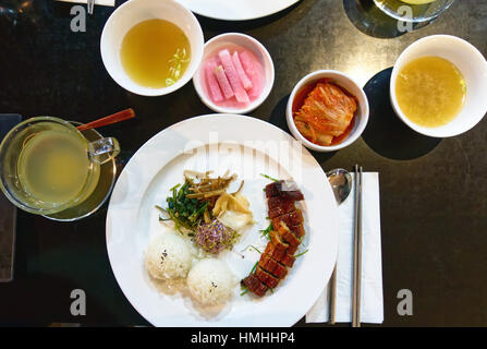 Korean Food Smoked Eel with Rice and Kimchee on a Table Stock Photo