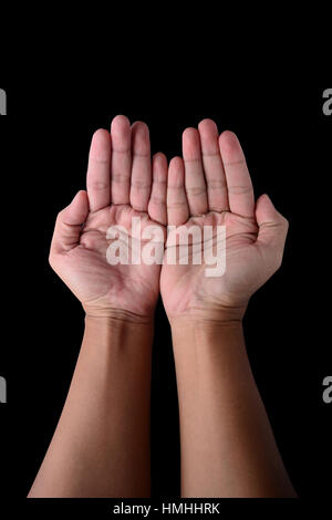 Two open empty hands with palms up, isolated on black with clipping path Stock Photo