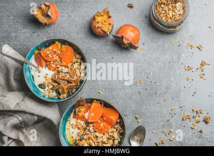 Healthy vegetarian breakfast in blue bowls, copy space Stock Photo