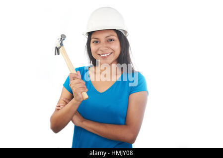 Girl with construction hat and hammer on a white background Stock Photo