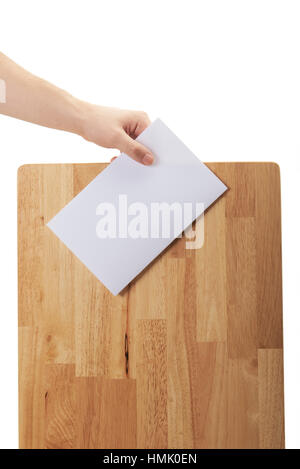 hand hold paper near wood box isolated on white Stock Photo