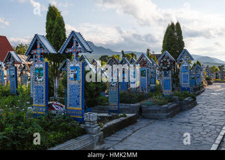 The Merry Cemetery, famous for its colourful tombstones covbered with naive paintings describing people who died Stock Photo