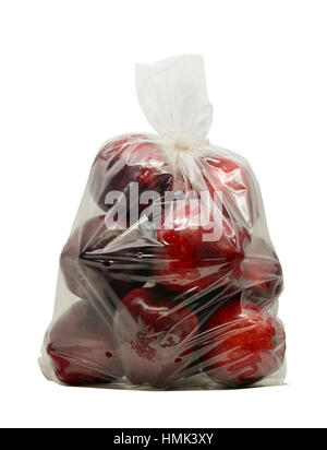 Red apples in plastic bag isolated on white with clipping path Stock Photo