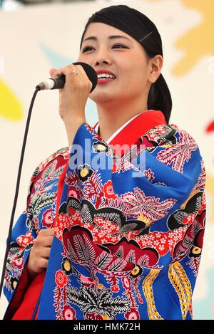 Young Okinawan woman in traditional kimono and with 
