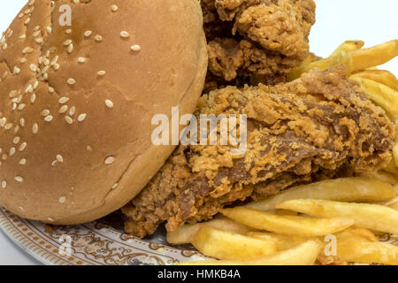 Tasty Fried potatoes with deep fried crunchy spicy chicken delicious Stock Photo