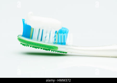 macro of tooth brush with paste isolated on white Stock Photo