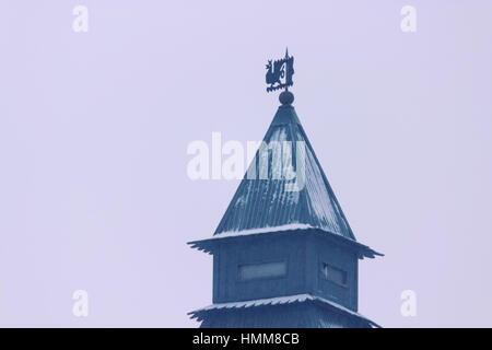 Brick round corner tower with a spire Stock Photo