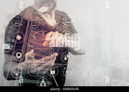 Double exposure of Businessman hand using smart phone for mobile payments online shopping,omni channel,virtual computer interface,London architecture Stock Photo
