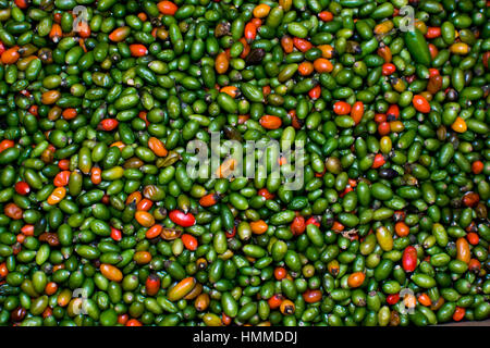 Red and green peppers on a market Stock Photo