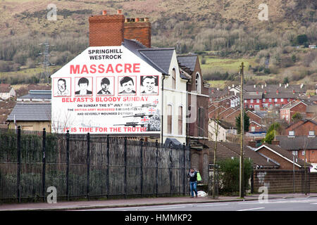 BELFAST, NORTHERN IRELAND - FEB 9, 2014: Mural of Springhill westrock massacre on Springfield Road in Belfast, Northern Ireland. Springfield Road was  Stock Photo