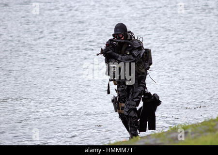 DEN HELDER, THE NETHERLANDS - JUNE 23: Dutch Special Forces combat diver during an amphibious assault demo during the Dutch Navy Days on June 23, 2013 Stock Photo