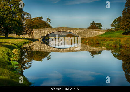 Bridge in Dallam Park, Milnthorpe, Cumbria passing over the river Bela Stock Photo