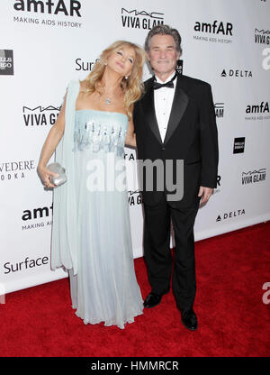 Goldie Hawn and Kurt Russell arrive at the amfAR Inspiration Gala on December 12, 2013 in Hollywood, California. Photo by Francis Specker Stock Photo