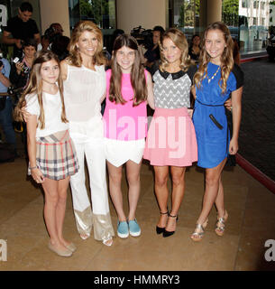 From left, Olivia Jade Giannulli, her mother, Lori Loughlin, Isabella Rose Giannulli, with Candace Cameron Bure and her daughter, Natasha Valerievna Bure arrive for the Hallmark Channel and Hallmark Movie Channel presentation at the 2013 Summer TV Critics Press Tour on July 24, 2013 in Beverly Hills, California. Photo by Francis Specker Stock Photo