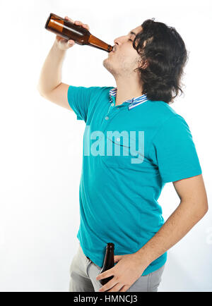 young man drink beer form brown bottle isolated on white Stock Photo