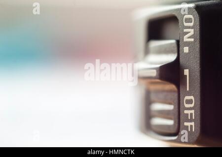 Close-up of little On/Off switch with soft blurred background Stock Photo
