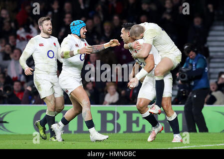 England's Ben Te'o (2nd right) celebrates scoring a try with team-mate Mike Brown during the RBS 6 Nations match at Twickenham Stadium, London.
