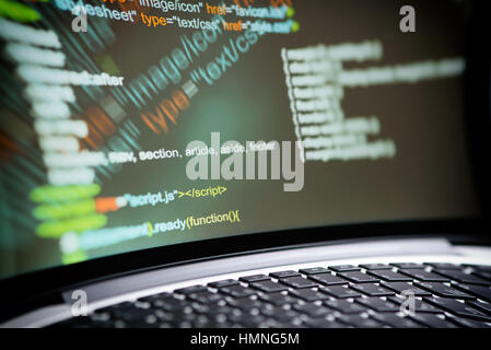 HTML code on a laptop screen. Editor for website concept. Stock Photo