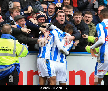 Huddersfield Town's Isaiah Brown (left) celebrates scoring his side's first goal of the game with Elias Kachunga during the Sky Bet Championship match at the John Smith's Stadium, Huddersfield. Stock Photo