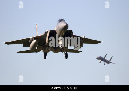 LEEUWARDEN, NETHERLANDS - APR 11, 2016: Two US Air Force F-15 Eagle fighter jets landing. Stock Photo