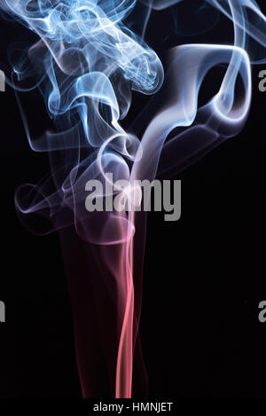 abstract colored swirls of fog isolated on black Stock Photo