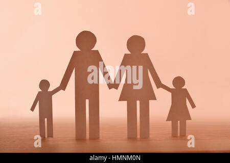 Concept family in paper on wood. Horizontal composition. Front view. Stock Photo