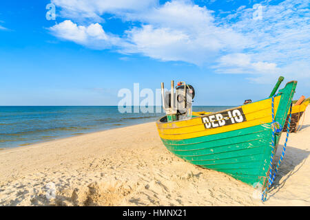 DEBKI BEACH, BALTIC SEA - JUN 22, 2016: typical colorful fishing boat on Debki beach on sunny beautiful summer day, coast of Baltic Sea, Poland Stock Photo