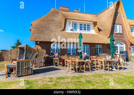 SYLT ISLAND, GERMANY - SEP 9, 2016: people dining in restaurant near Monsur cliff, Sylt island, Germany. Stock Photo