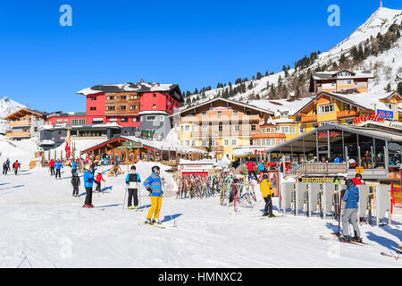 OBERTAUERN SKI RESORT, AUSTRIA - JAN 22, 2017: skiers on winter vacation in Obertauern ski area in Salzburg land, Austrian Alps. Stock Photo