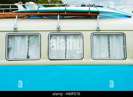 1965 VW split screen camper van with surfboards on roof rack abstract. UK Stock Photo