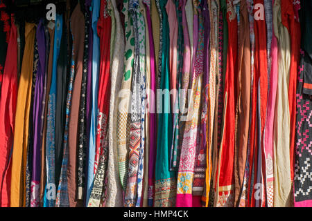 An array of colorful saris for sale outdoors on 73rd Street in Jackson Heights,, Queens, New York. Stock Photo